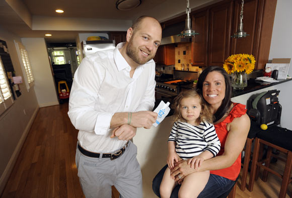 EZSqueezees founders Jordan and Alexis Takas, with two-year-old Barrett
